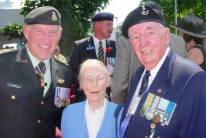 General Walter Natynczyk, CDS, with Dr. Eileen Nason Cambon, Dr. Kenneth Cambon's widow, and 3201 Austen Cambon, in Ottawa August 15, 2009 at the unveiling of the Memorial Wall honouring the Veterans of the Battle of Hong Kong, 1941.