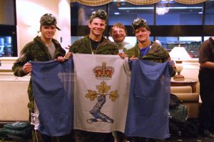 4.	Officer Cadets Neppel, Vachon and Bonvouloir right after completing the half marathon with a CBRN breathing apparatus. / Les Élèves-officiers Neppel, Vachon et Bonvouloir qui ont complété la course munis d’un masque CBRN. 