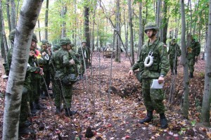 Officer Cadet 25550 Olivier Bonvouloir, a senior cadet at RMC Saint-Jean, gives his orders to his squadron during a weekend exercise in Farnham