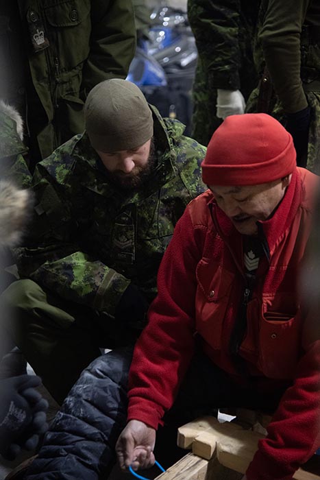 Candidates on the Arctic Operations course learn how to construct toboggans from members of the Canadian Forces Rangers in Resolute Bay, Nunavut on 19 February, 2022.

 Credit: S1 Larissa De Guzman, Canadian Armed Forces Imagery