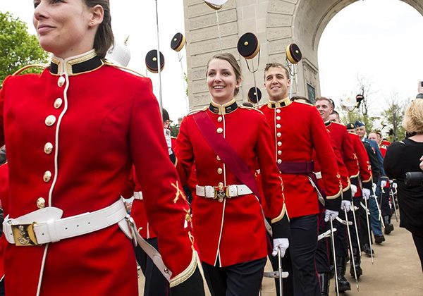 Officer Cadets of Royal Military College of Canada march through the Memorial Arch upon graduation. Royal Military College of Canada (RMCC) Commissioning Parade. Reviewing Officer General Tom Lawson, Chief of Defence Staff. 15 May 2015 at RMCC, Kingston, On.